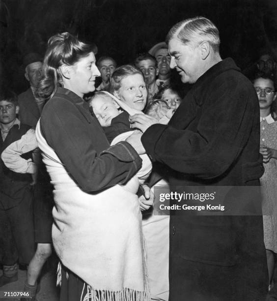 Labour MP for Ebbw Vale and Minister of Health, Aneurin Bevan talks to constituent Megan Price in his home town of Tredegar, during the general...