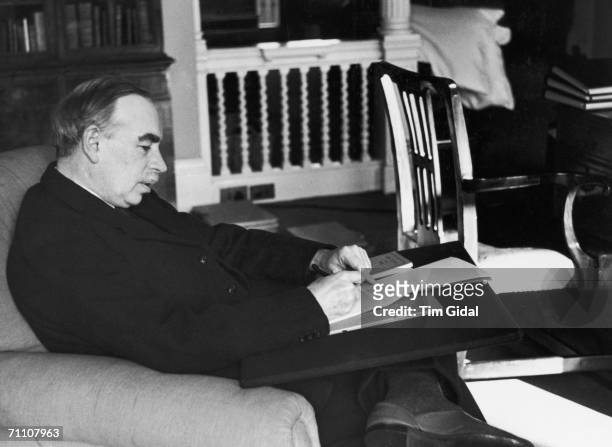 British economist John Maynard Keynes in his study in Gordon Square, Bloomsbury, London, 16th March 1940. Original publication: Picture Post - 361 -...
