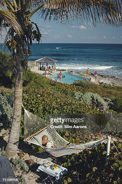 College student Jan Woods relaxes in a hammock at the Abaco Inn on Elbow Cay, one of the Abaco Islands in the Bahamas, March 1986.
