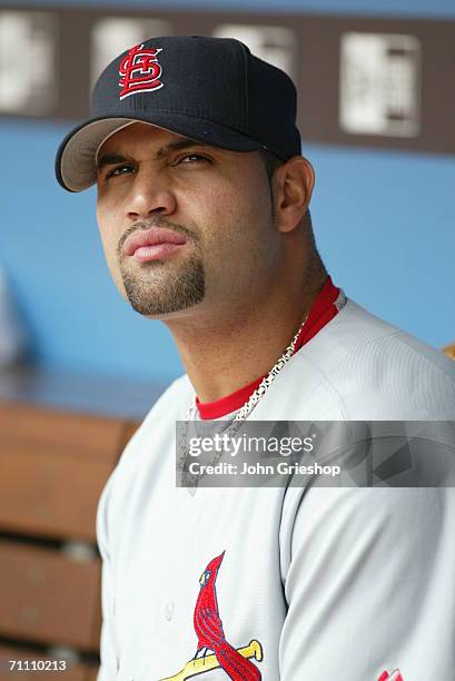 Albert Pujols of the St. Louis Cardinals sits in the dugout during the game against the Cincinnati Reds at Great American Ball Park in Cincinnati,...