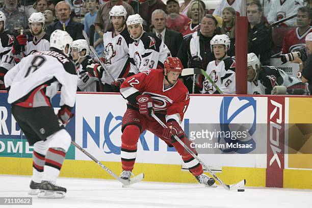 Center Eric Staal of the Carolina Hurricanes controls the puck against the Buffalo Sabres in game five of the Eastern Conference Finals during the...