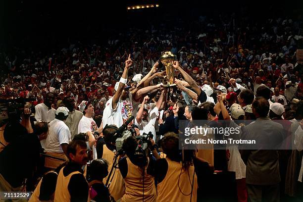 The Houston Rockets celebrate at midcourt after defeating the Orlando Magic 113 to 101 in Game five of the NBA finals to win the 1995 NBA...