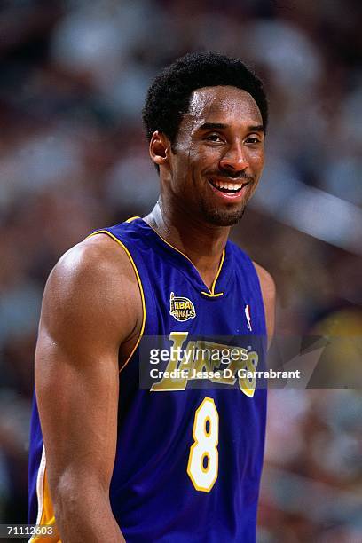 Kobe Bryant of the Los Angeles Lakers cracks a smile during game four of the 2001 NBA Finals against the Philadelphia 76ers, played June 13, 2001 at...