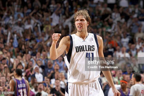 Dirk Nowitzki of the Dallas Mavericks celebrates his playoff career high fifty points against the Phoenix Suns in game five of the Western Conference...