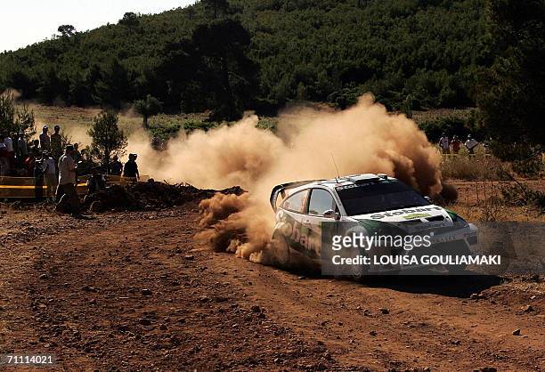 British Matthew Wilson and Michael Orr drive their Ford focus RS at Kineta special stage, west of Athens, on the third day of the Rally Acropolis 03...