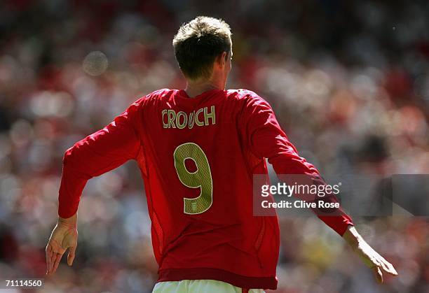 Peter Crouch of England dances in celebration after scoring his team's third goal during the International Friendly between England and Jamaica at...