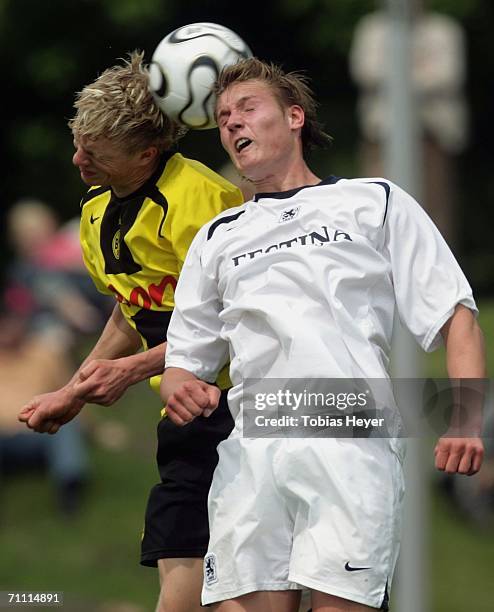 Manuel Sch?ffler of Munich and Christopher Heermann of Dortmund both go into a challenge during the B Juniors Championship Final between Borussia...