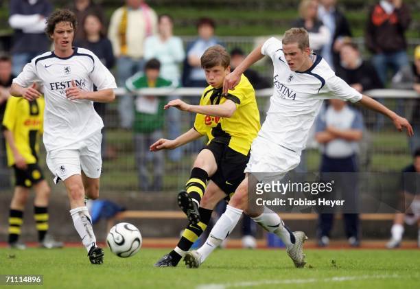 Dominik Lipki makes a pass past Stefan Alschinger and Sven Bender during the B Juniors Championship Final between Borussia Dortmund and TSV 1860...