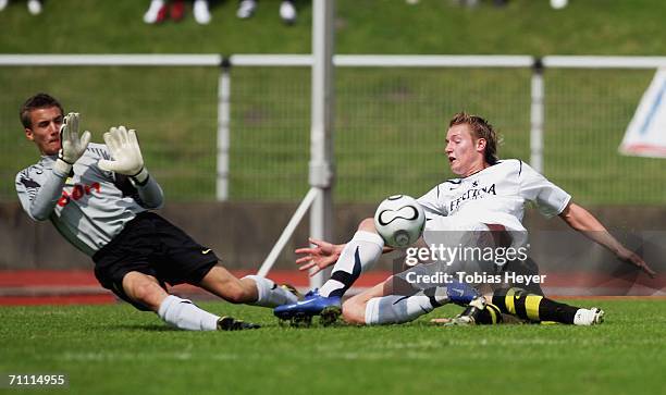 Manuel Schaeffler of Munich goes to ground after taking a shot against goalkeeper Jonathan Mellwig of Dortmund during the B Juniors Championship...