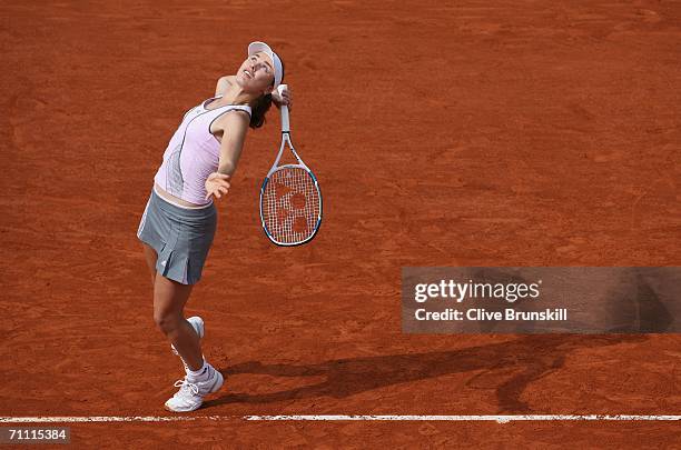 Martina Hingis of Switzerland serves against Ivana Lisjak of Croatia during day seven of the French Open at Roland Garros on June 3, 2006 in Paris,...