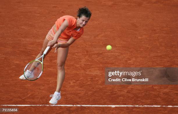 Ivana Lisjak of Croatia serves against Martina Hingis of Switzerland during day seven of the French Open at Roland Garros on June 3, 2006 in Paris,...