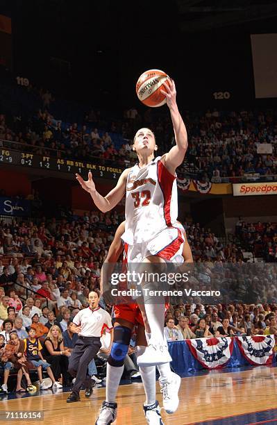 Katie Douglas of the Connecticut Sun goes to the basket against the Charlotte Sting on June 3, 2006 at Mohegan Sun Arena in Uncasville, Connecticut....