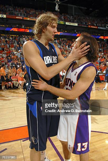 Dirk Nowitzki of the Dallas Mavericks embraces Steve Nash of the Phoenix Suns after the Mavericks win the Western Conference Championship Series in...