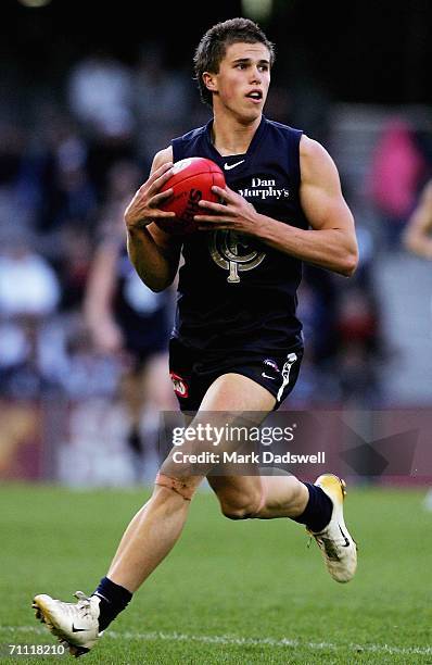 Marc Murphy of the Blues looks for a teammate during the round 10 AFL match between the Carlton Blues and the Port Adelaide Power at the Telstra Dome...