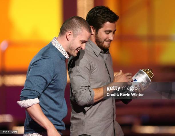 Singer Justin Timberlake present the "Best Kiss" award to actor Jake Gyllenhaal for the film Brokeback Mountain onstage at the 2006 MTV Movie Awards...