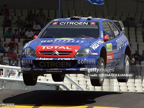 Sebastien Loeb of France with co-drivel Daniel Elena of Monaco speed up their Citroen Xsara at the last super special stage of the 53rd Rally...