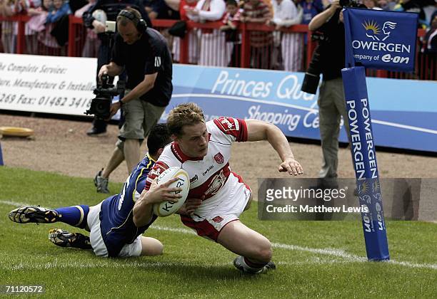 Gareth Morton of Hull beats Chris Bridge of Warrington to score a try during the Powergen Challenge Cup Quarter Final match between Hull Kingston...