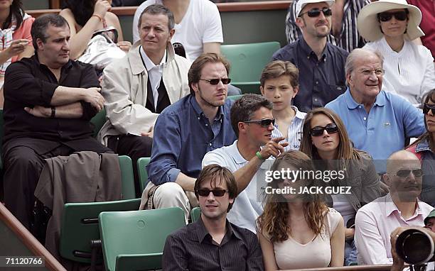 French actors Francis Huster , Pierre Mondy and musician Thomas Dutronc are seen in the stands during the French tennis Open at Roland Garros in...