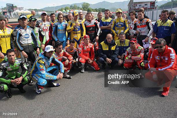 Moto GP riders observe a minute of silence in memory of Edouard Michelin, President of Michelin and Umberto Masetti, former world champion prior to...