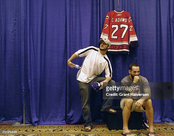 Chad LaRose and Craig Adams of thhe Carolina Hurricanes wait for the end of an NHL Stanley Cup media availability session at the Marriott Crabtree...