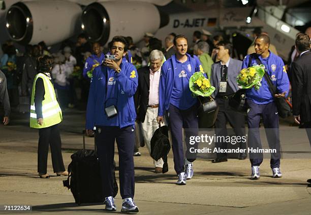 Kaka of Brazil uses a video camera as he and other members of the Brazilian national football team arrive on June 4, 2006 at Frankfurt Airport in...