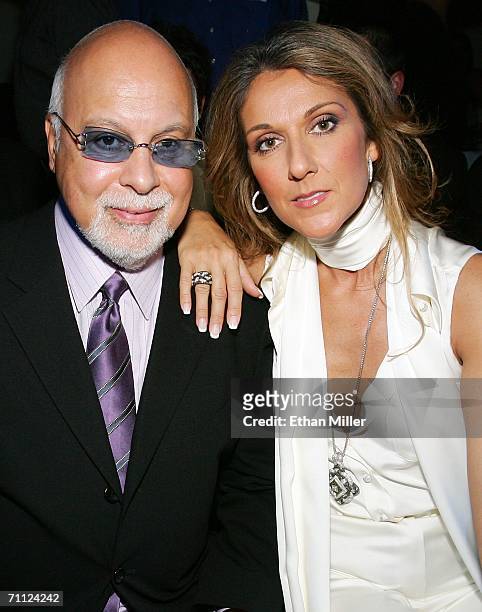 Singer Celine Dion and her husband and manager Rene Angelil pose before a fashion show by jewelry designer Chris Aire at the Pure Nightclub at...