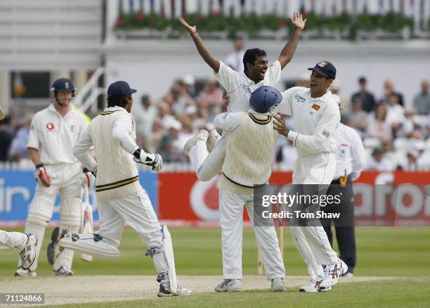 Muttiah Muralitharan of Sri Lanka is congratulated after taking the wicket of Andrew Flintoff of England during day four of the third npower Test...