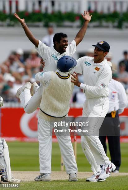 Muttiah Muralitharan of Sri Lanka is congratulated after taking the wicket of Andrew Flintoff of England during day four of the third npower Test...