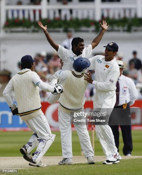 Muttiah Muralitharan of Sri Lanka is congratulated after taking the wicket of Andrew Flintoff of England during day four of the third npower Test...