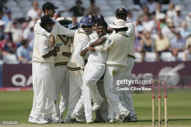 Muttiah Muralitharan of Sri Lanka celebrates with his team mates after taking the wicket of Paul Collingwood during day four of the third npower test...