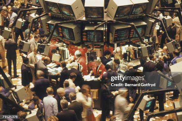 View of traders on the floor of the New York Stock Exchange, New York, New York, 1970s.