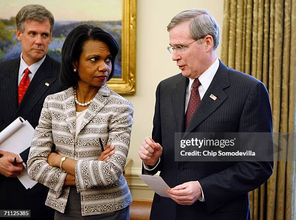 White House Press Secretary Tony Snow, Secretary of State Condoleezza Rice and National Security Advisor Stephen Hadley talk in the Oval Office while...