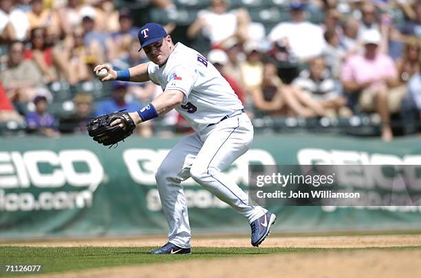 Hank Blalock of the Texas Rangers fields during the game against the Tampa Bay Devil Rays at Ameriquest Field in Arlington in Arlington, Texas on...