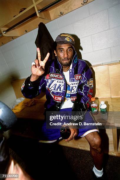 Kobe Bryant of the Los Angeles Lakers celebrates the Lakers' NBA Championship in the locker room after defeating the Philadelphia 76ers in game five...