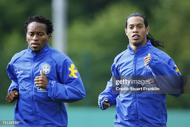 Ze Roberto and Ronaldinho of Brazil run during the training session of the Brazilian National Team for the FIFA World Cup 2006 on June 6, 2006 in...