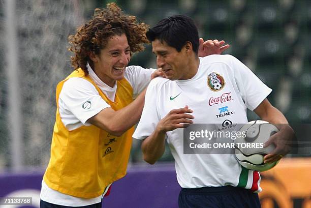 Mexico's players Carlos Guardado jokes with Ricardo Osorio at the end of Mexico's National team training at Jahnstadion in Gottingen, 06 June...