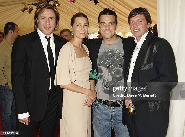 Simon Le Bon, Yasmin LeBon, Robbie Williams and Lee Sharpe attend a Gala Dinner in aid of the Five Star Scanner Appeal, which aims to raise funds for...