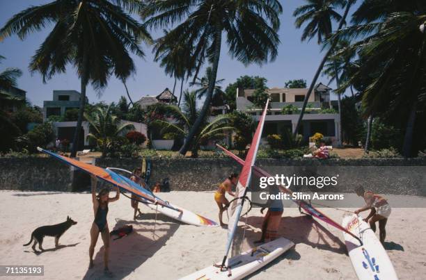 Windsurfers on the beach of the Peponi Hotel on Lamu Island, in the Lamu Archipelago of Kenya, February 1987.