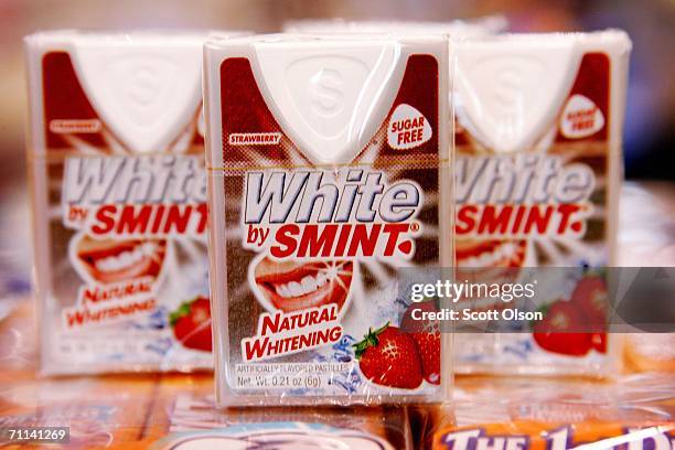 New White sugar-free teeth whitening mint containers, manufactured by Smint, lie on display at the All Candy Expo confectioner's trade show June 6,...