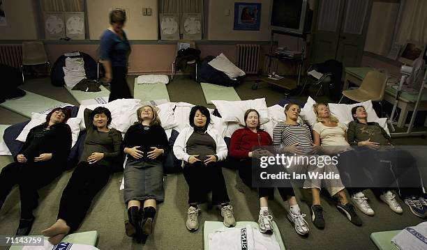 Group of pregnant women perform relaxation techniques during a pre-natal class at Royal North Shore Hospital June 7, 2006 in Sydney, Australia....