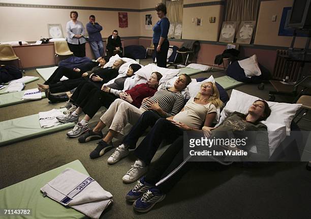 Group of pregnant women perform relaxation techniques during a pre-natal class at Royal North Shore Hospital June 7, 2006 in Sydney, Australia....