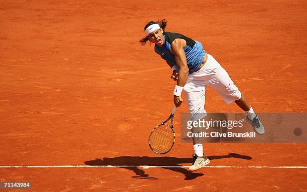 Rafael Nadal of Spain serves against Novak Djokovic of Serbia and Montenegro during day eleven of the French Open at Roland Garros on June 7, 2006 in...