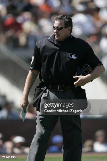 Umpire Paul Emmel stands on the field during the game between the San Francisco Giants and the Los Angeles Dodgers at AT&T Park in San Francisco,...