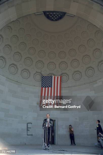 An unidentified man stands behind some microphones before an anti-draft and anti-war demonstration at the bandshell in Central Park, New York, April...