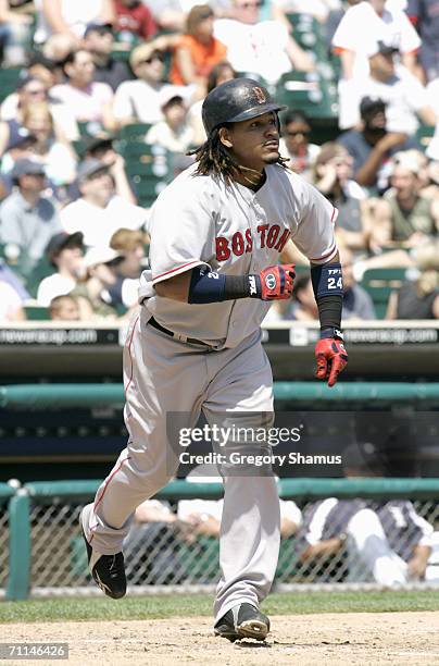 Manny Ramirez of the Boston Red Sox runs to first base during the game against the Detroit Tigers on June 4, 2006 at Comerica Park in Detroit,...