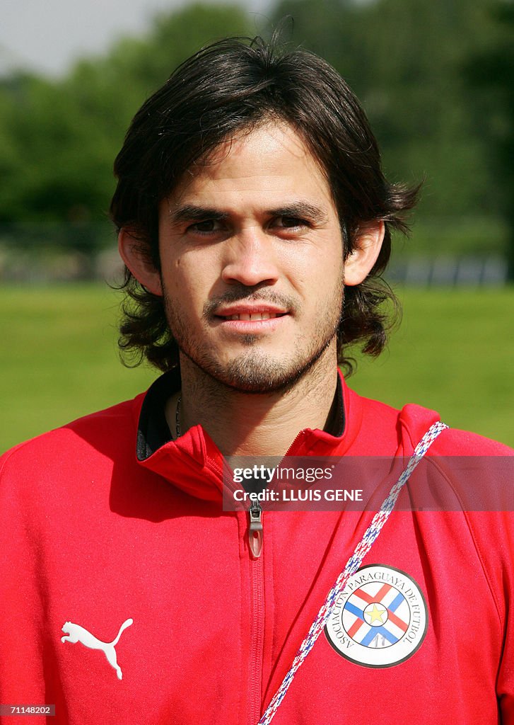 Paraguayan miedfielder Diego Gavilan poses for photographers after a