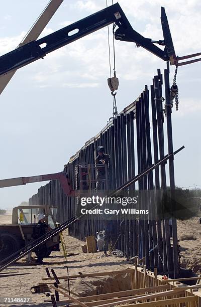 Members of the 116th Construction Support Equipment Company from the Utah National Guard in Spanish Fort, Utah, work on building 1,000 yards of...