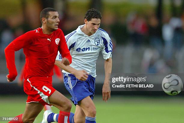 Tunisian forward Yassine Chikhaoui vies Bavarian FA Selection Arber Morina during a friendly football match at Saks Stadium in Schweinfurt, 07 June...