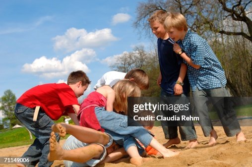 Kids Playing Roughly Children Play Fighting On Playground High-Res Stock Photo - Getty Images