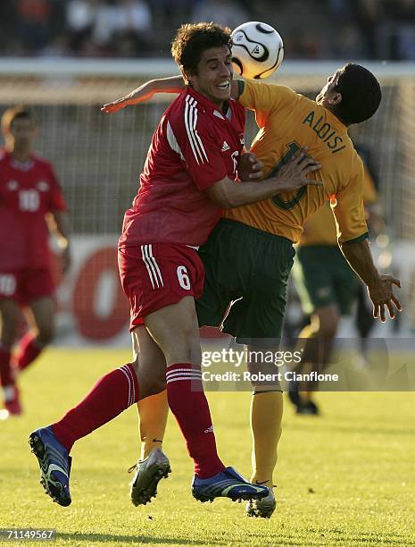 Mario Stocklasa of Liechtenstein challenges John Aloisi of Australia during the international friendly between Australia and Liechtenstein at the...